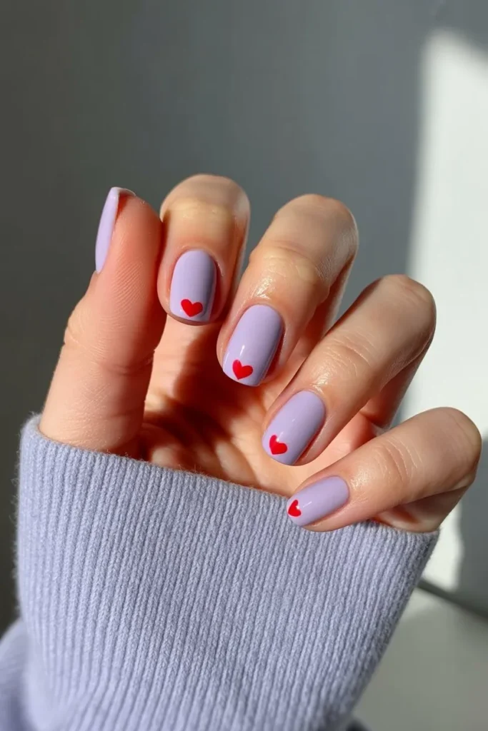 Short lavender nails with red heart tip