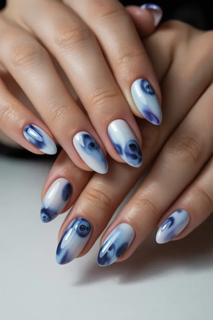 Almond-shaped blueberry milk nails
