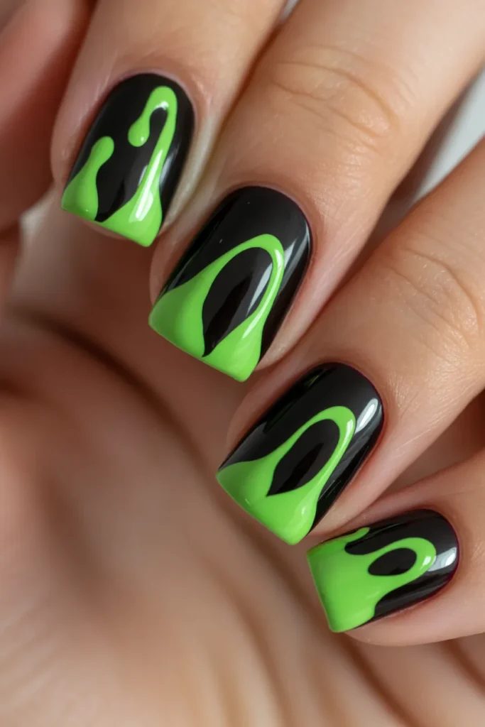 Black nails with neon green dripping effect