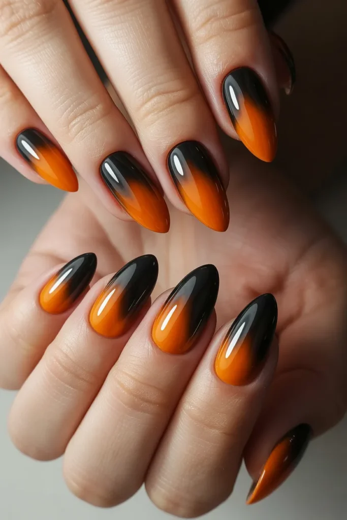 Black to orange ombre nails