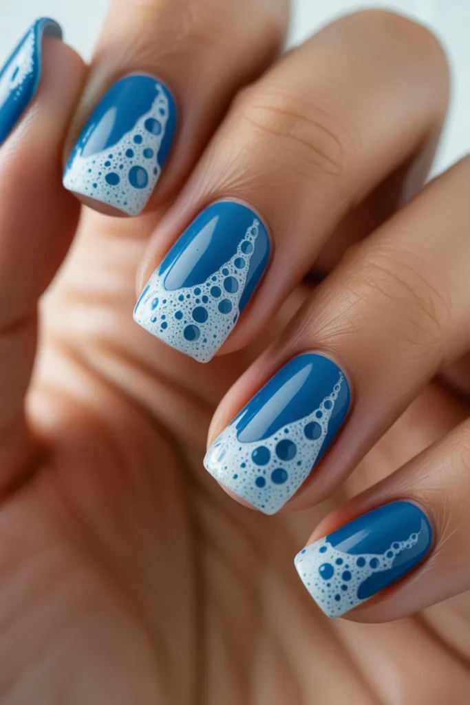Blue nails with white bubbly foam effect