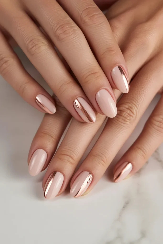 Blush nails with rose gold accents