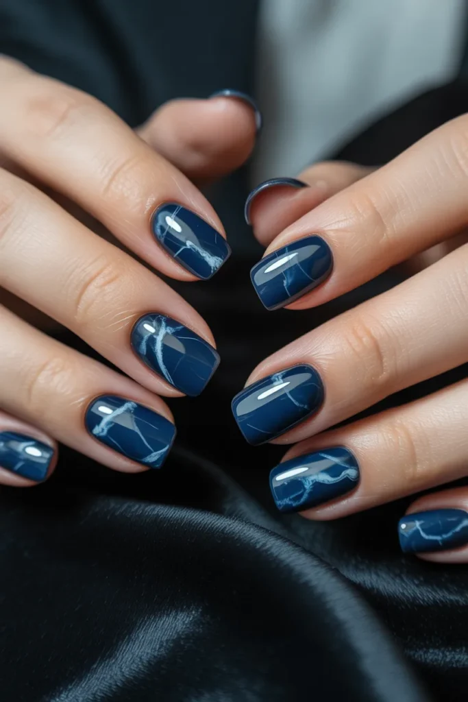 Dark blue marble nails with white veins