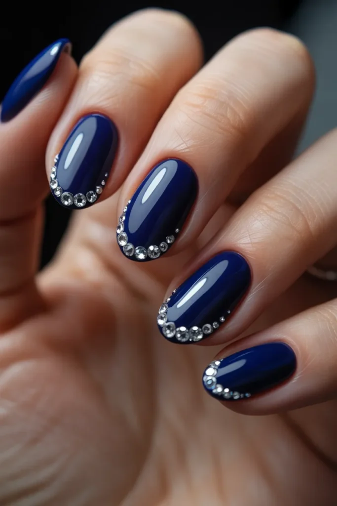 Dark blue nails with crystal tip accents