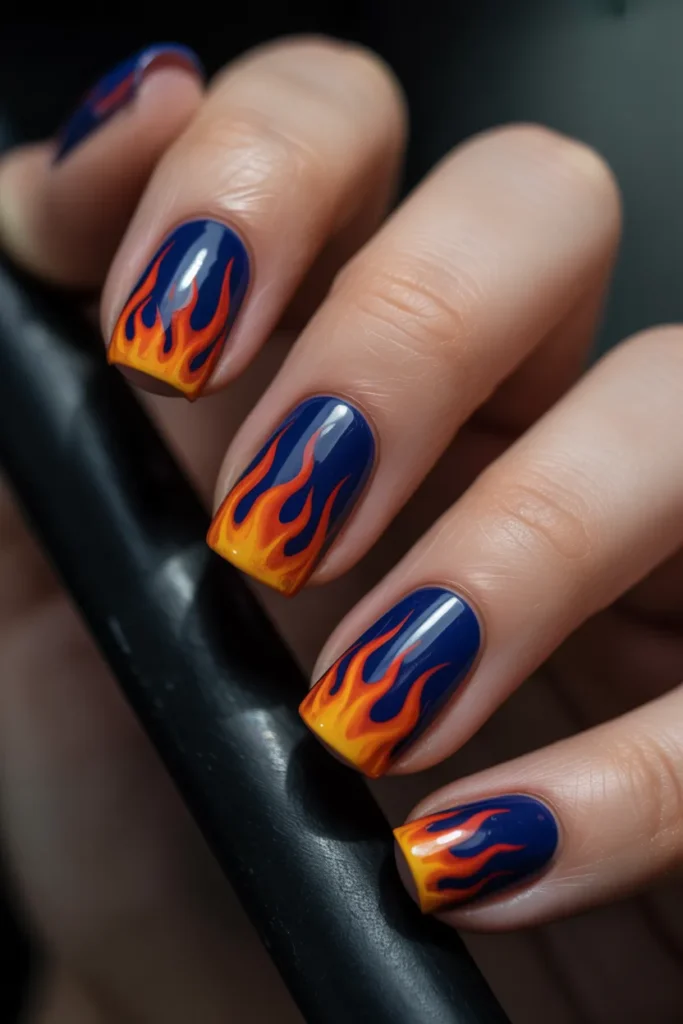 Dark blue nails with flame art