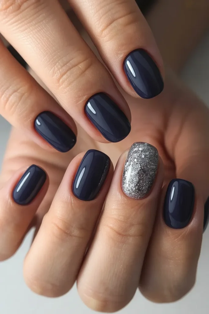 Dark blue nails with one glitter accent nail