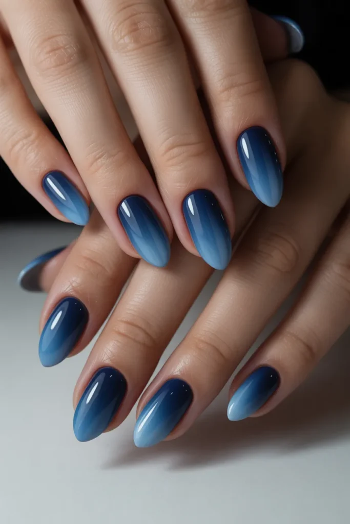Dark blue to light blue ombre nails