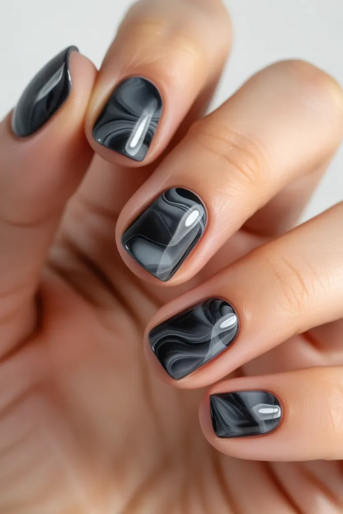 Dark marble nails, black and grey swirl design