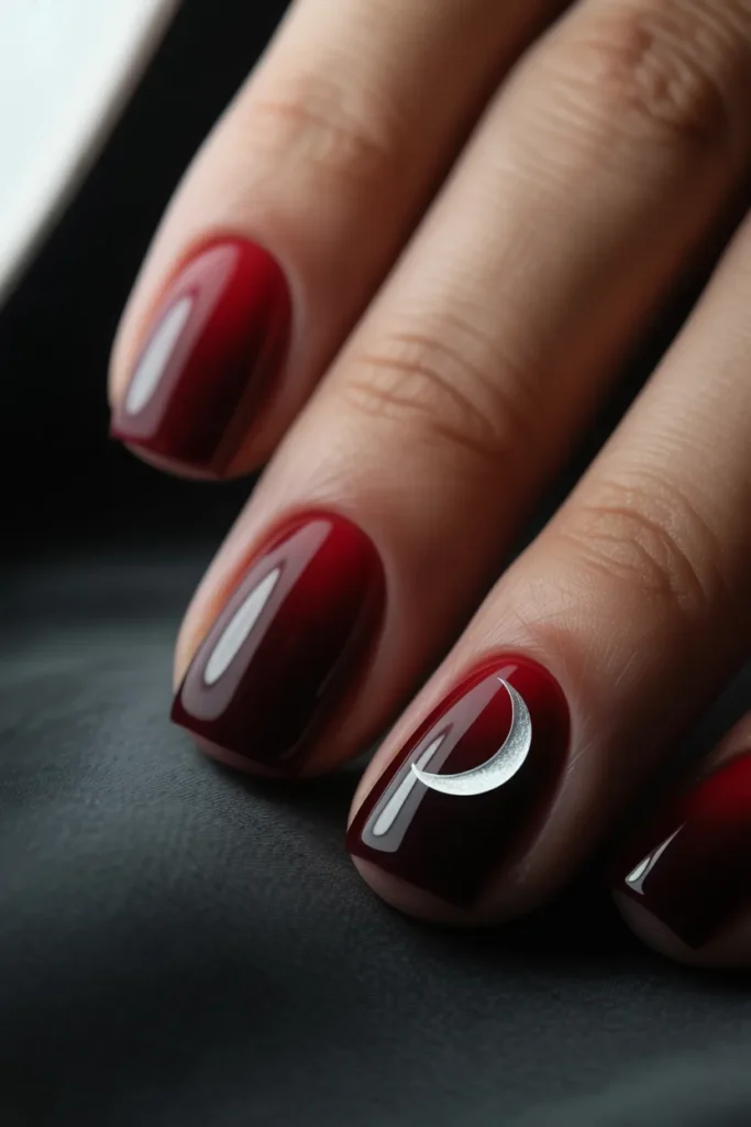 Deep red ombré fading into black with a glowing moon accent