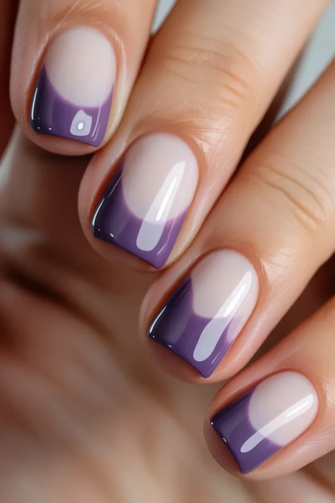 Drip nail art in purple over milky base