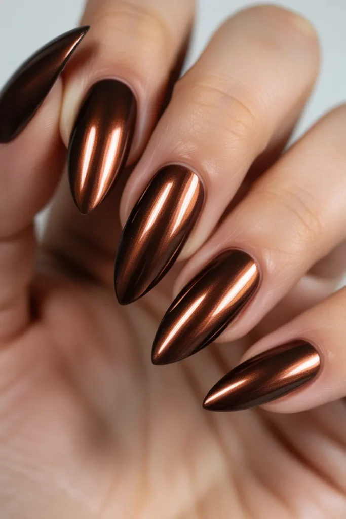 Metallic chrome chocolate brown nails, reflective surface