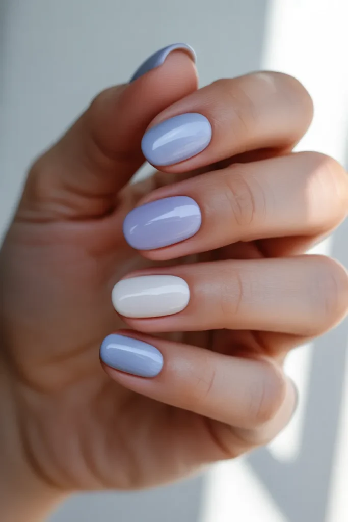 Mix of lavender, white, and soft blue nails