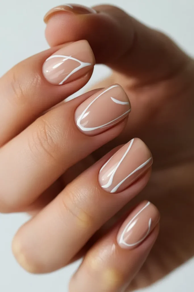Nude nails with thin white abstract lines