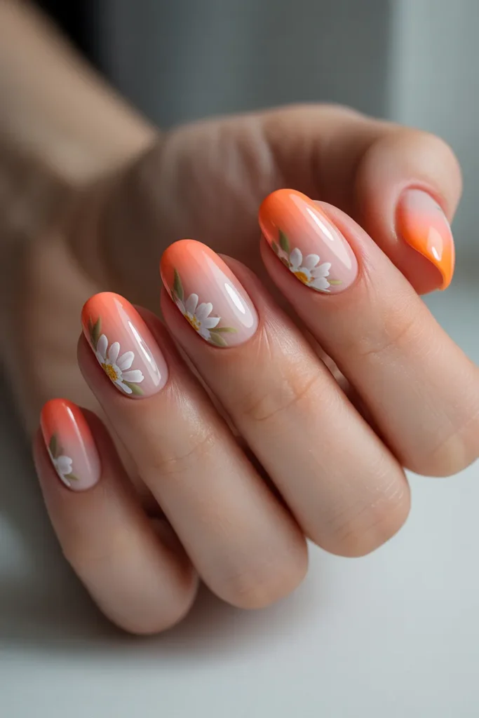 Ombre pink nails to orange with floral accents