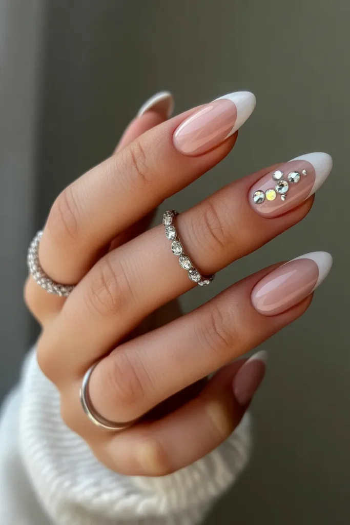 Oval nails nude base with crystal rhinestones
