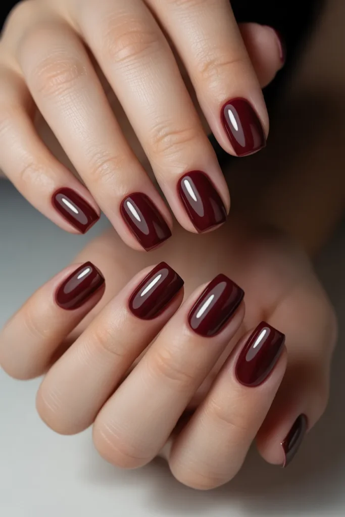 Short square nails in deep burgundy wine color