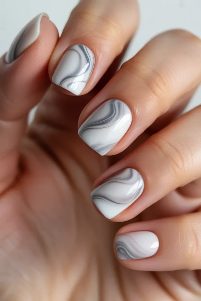 Short square nails with white and grey marble design