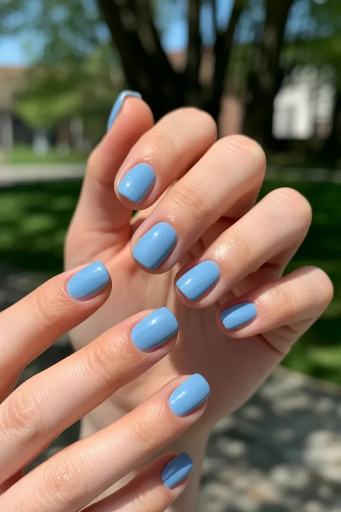 Soft sky blue short square nails outdoors